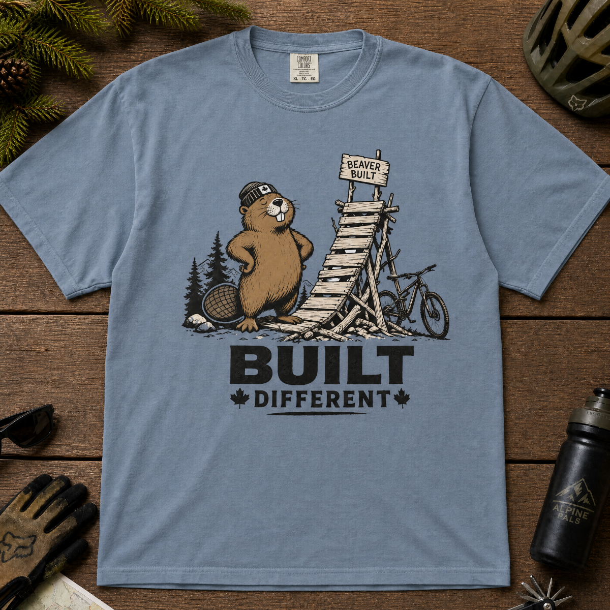 Blue jean colored t-shirt with a beaver graphic and 'Built Different' text.