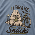 Blue jean colored t-shirt with 'I Brake For Snacks' text and a marmot eating a bar with a mountain bike on the side.