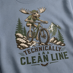 Blue jean colored t-shirt with a graphic of a moose riding a bike and text 'Technically A Clean Line'.