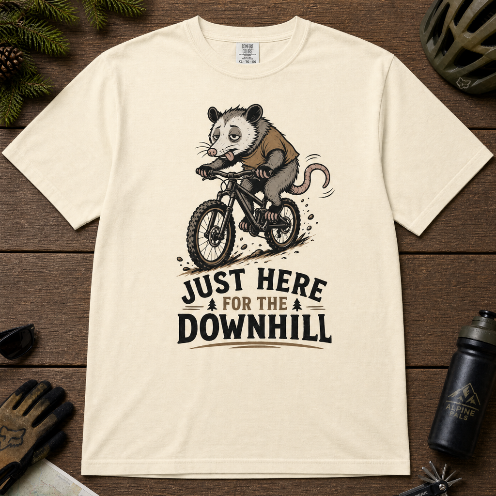 Ivory white t-shirt with an opossum riding a bike graphic and text 'Just Here for the Downhill'.