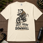 Ivory white t-shirt with an opossum riding a bike graphic and text 'Just Here for the Downhill'.