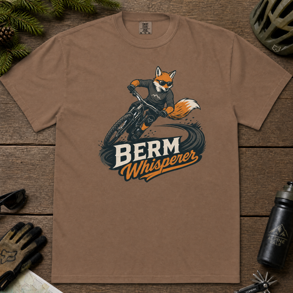 Espresso brown t-shirt with a graphic of a fox riding a bike and ' Berm Whisperer'.