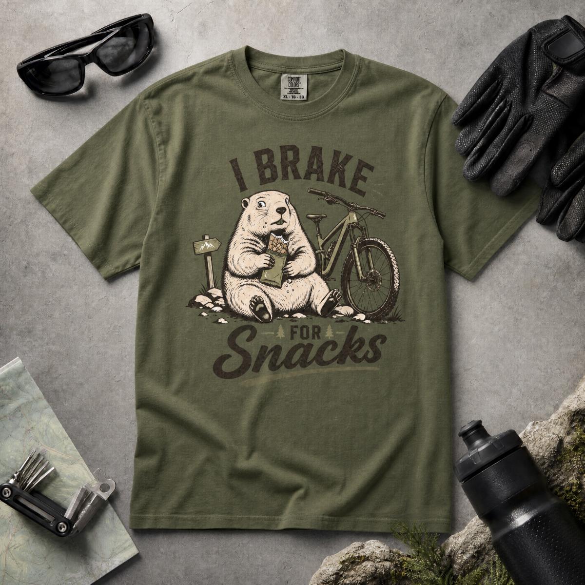 Hemp green t-shirt with 'I Brake For Snacks' text and a marmot eating a bar with a mountain bike on the side.