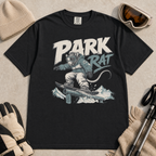 Black t-shirt with graphic of a rat snowboarding and 'Park Rat' text on a dark background