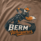 Espresso brown t-shirt with a graphic of a fox riding a bike and ' Berm Whisperer'.