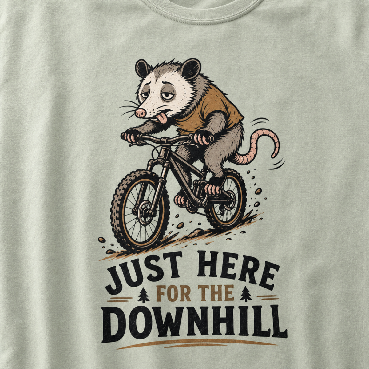 Bay green t-shirt with an opossum riding a bike graphic and text 'Just Here for the Downhill'.