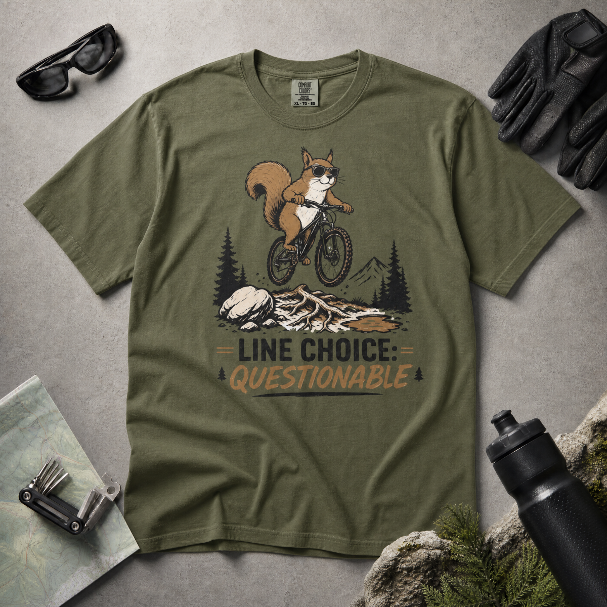Hemp green t-shirt with a graphic of a squirrel on a bike and text 'Line Choice: Questionable'.