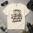Ivory white colored t-shirt with 'I Brake For Snacks' text and a marmot eating a bar with a mountain bike on the side.