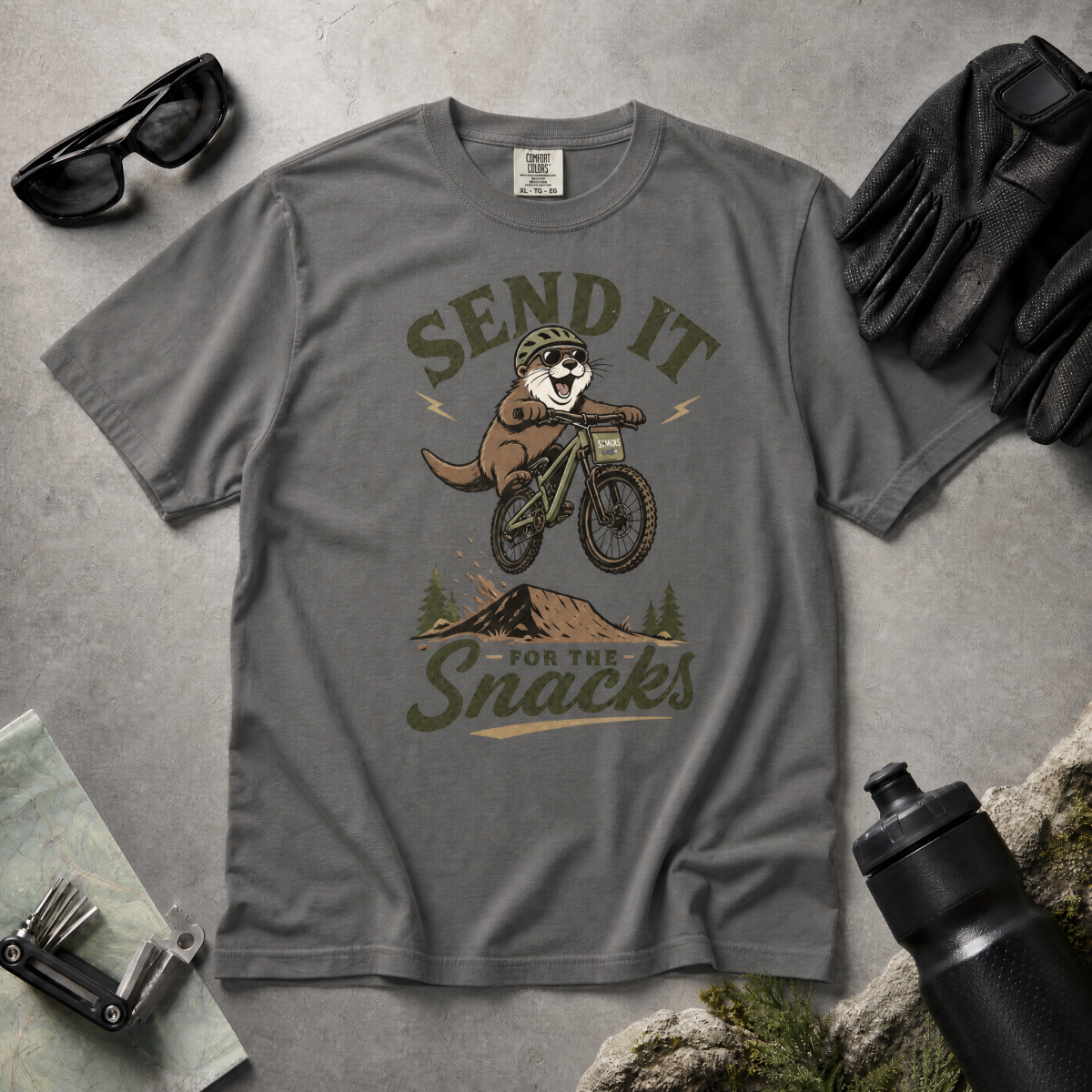 Pepper gray t-shirt with a graphic of a beaver on a bike and text 'Send it for the snacks'.
