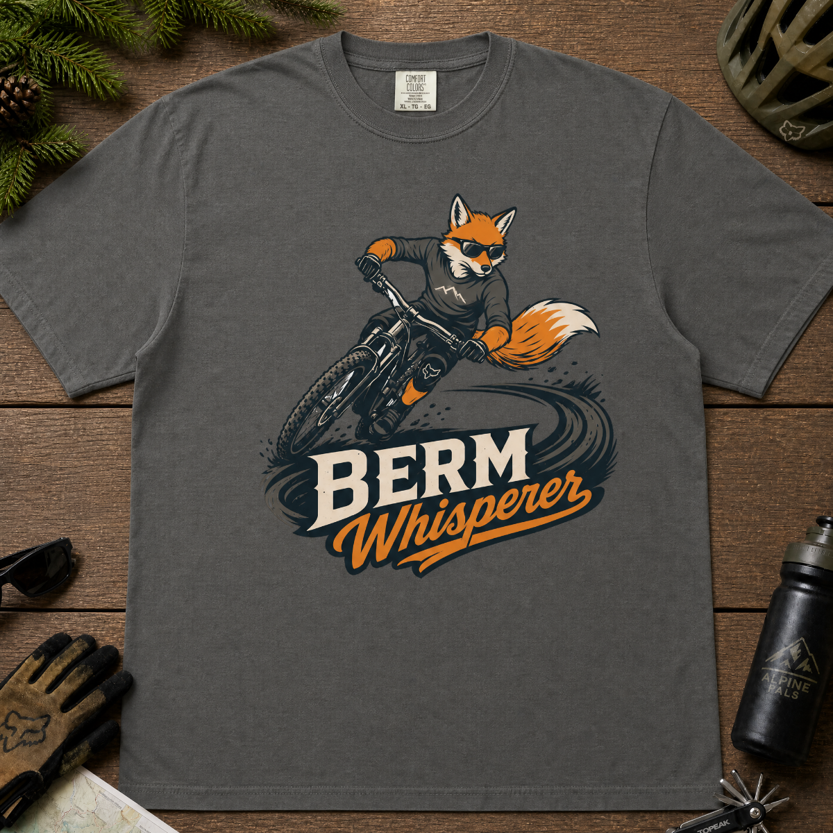 Pepper gray t-shirt with a graphic of a fox riding a bike and ' Berm Whisperer'.