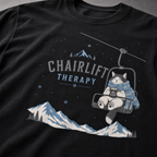 Black t-shirt with 'Chairlift Therapy' graphic design.
