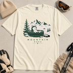 Ivory white t-shirt with a graphic of a husky in a hot tub surrounded by mountains and trees.
