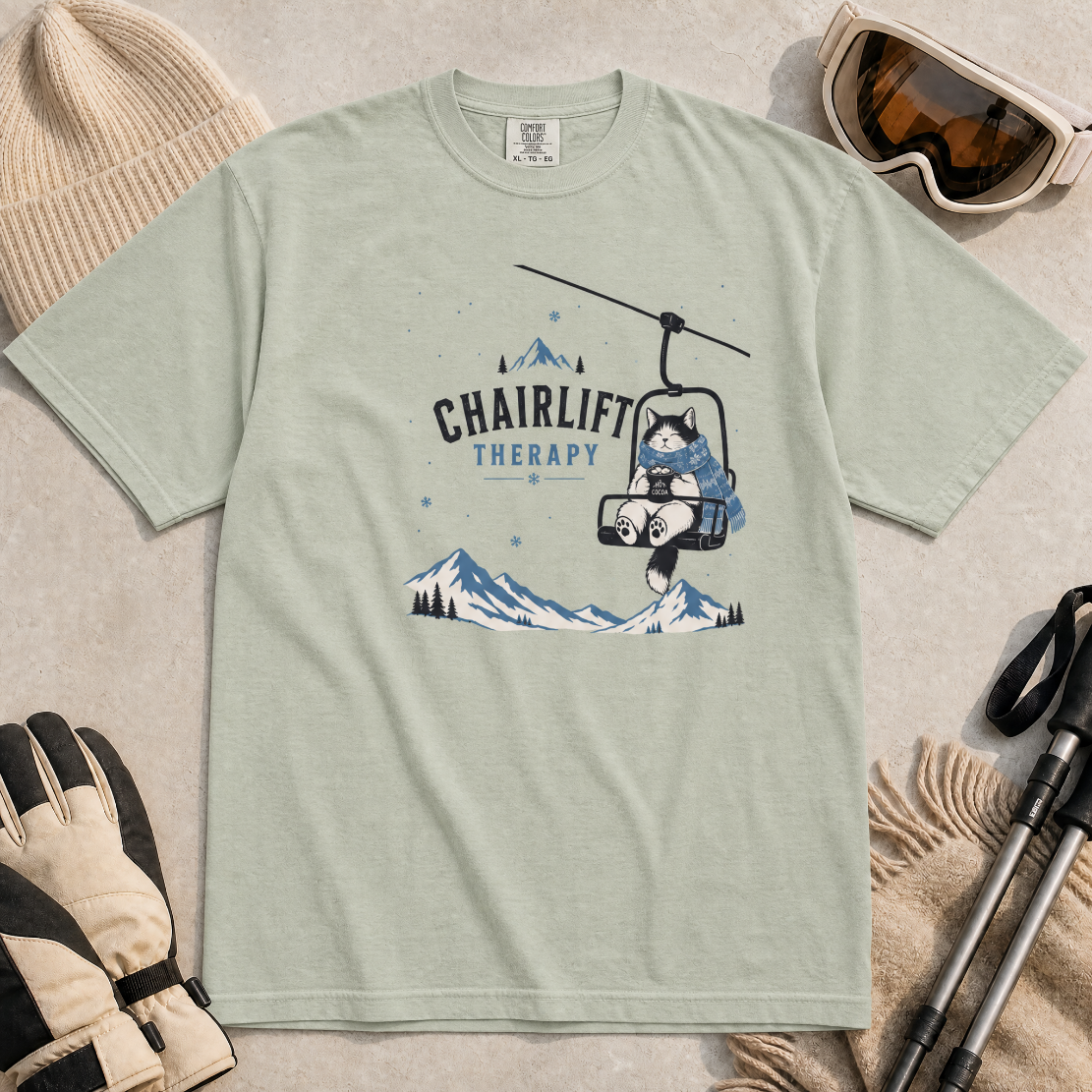 Bay green t-shirt with 'Chairlift Therapy' graphic design.