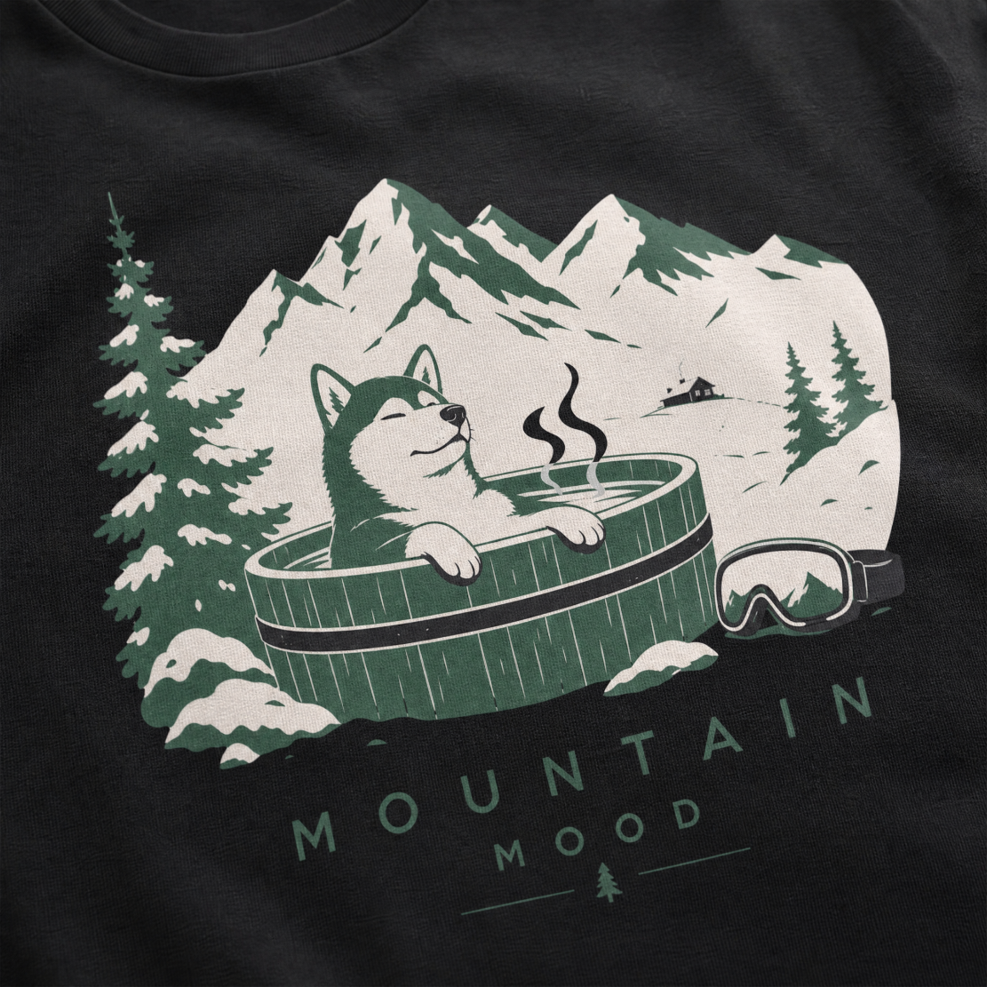Black t-shirt with a graphic of a husky in a hot tub surrounded by mountains and trees.