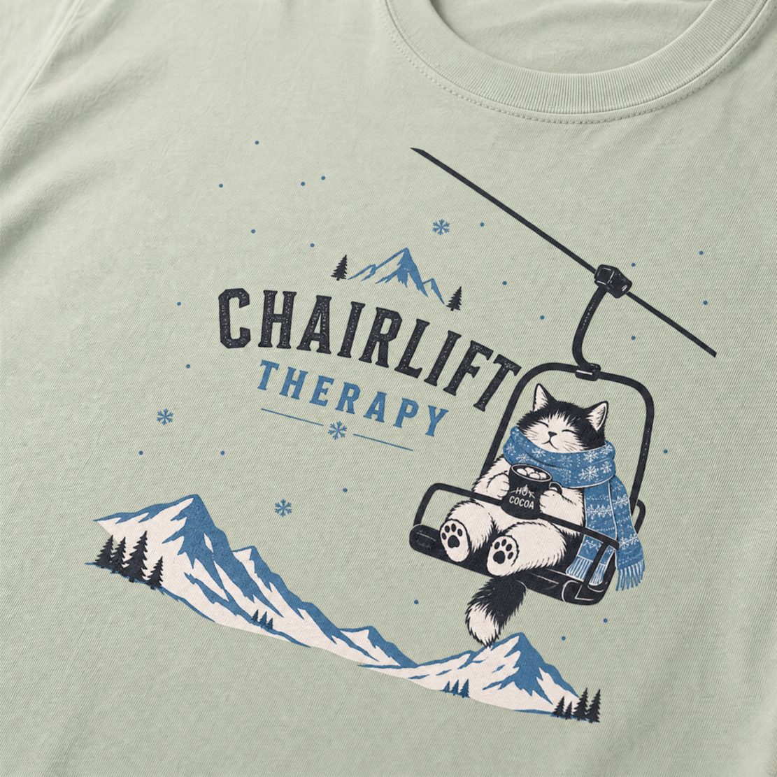 Bay green t-shirt with 'Chairlift Therapy' graphic design.