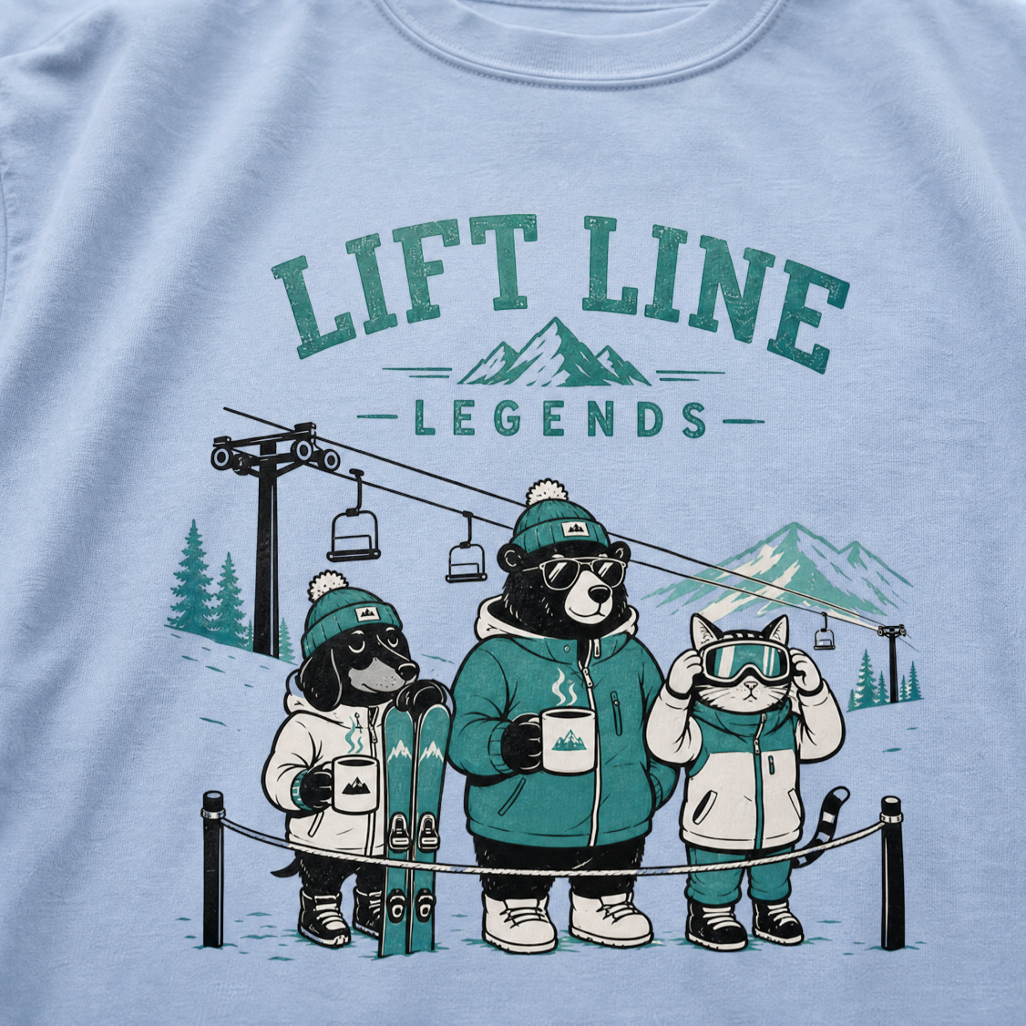 Washed denim blue t-shirt with 'Lift Line Legends' graphic design featuring a bear, cat, , dog, and a ski lift.