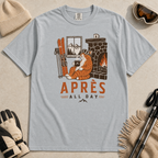 Granite gray t-shirt with a graphic of a cat by a fireplace and skis, with 'Après All Day' text.