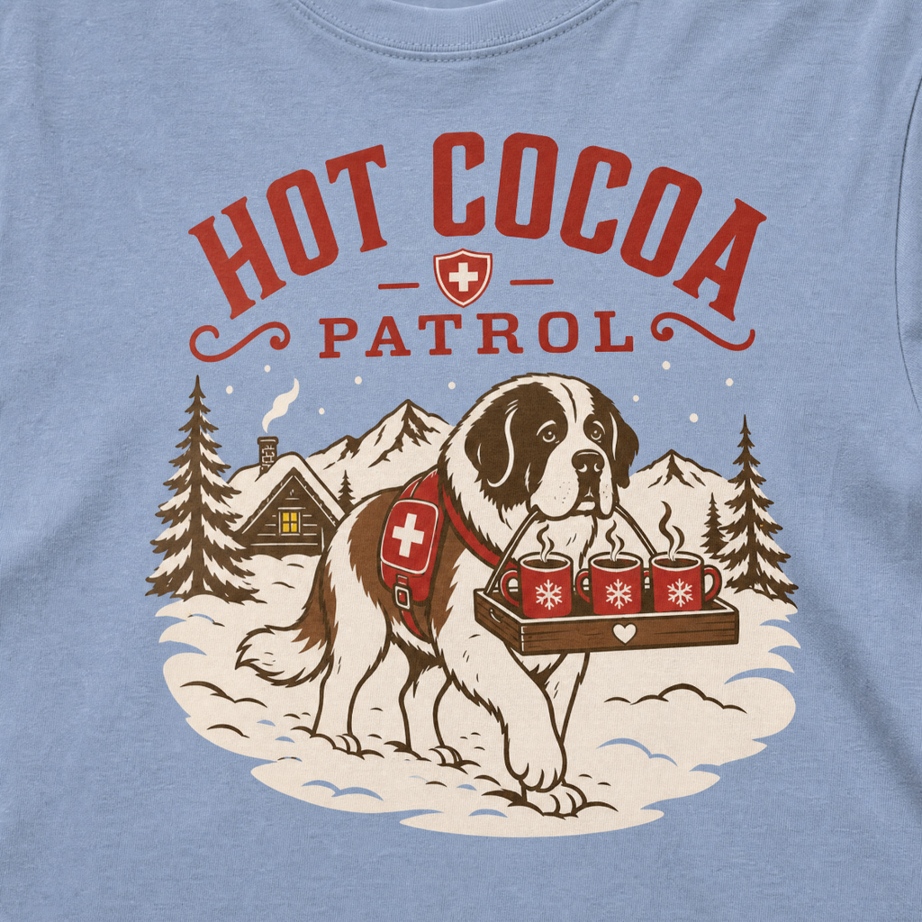 Washed denim blue t-shirt with a graphic of a dog and 'Hot Cocoa Patrol' text.