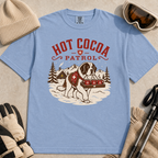 Washed denim blue t-shirt with a graphic of a dog and 'Hot Cocoa Patrol' text.