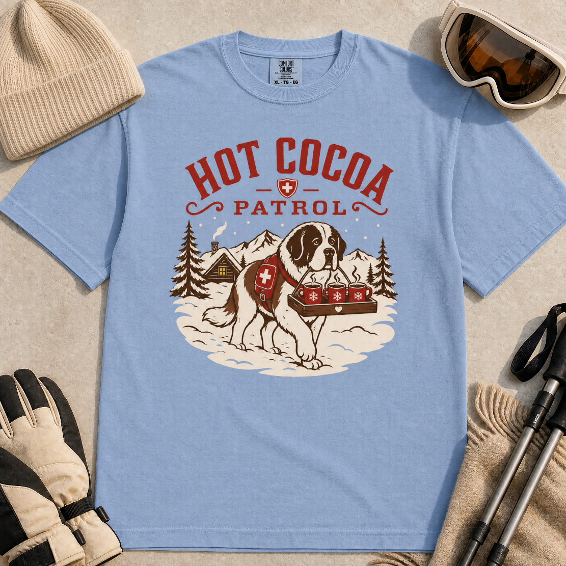 Washed denim blue t-shirt with a graphic of a dog and 'Hot Cocoa Patrol' text.
