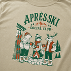Khaki colored t-shirt with 'Apres Ski Social Club' graphic.
