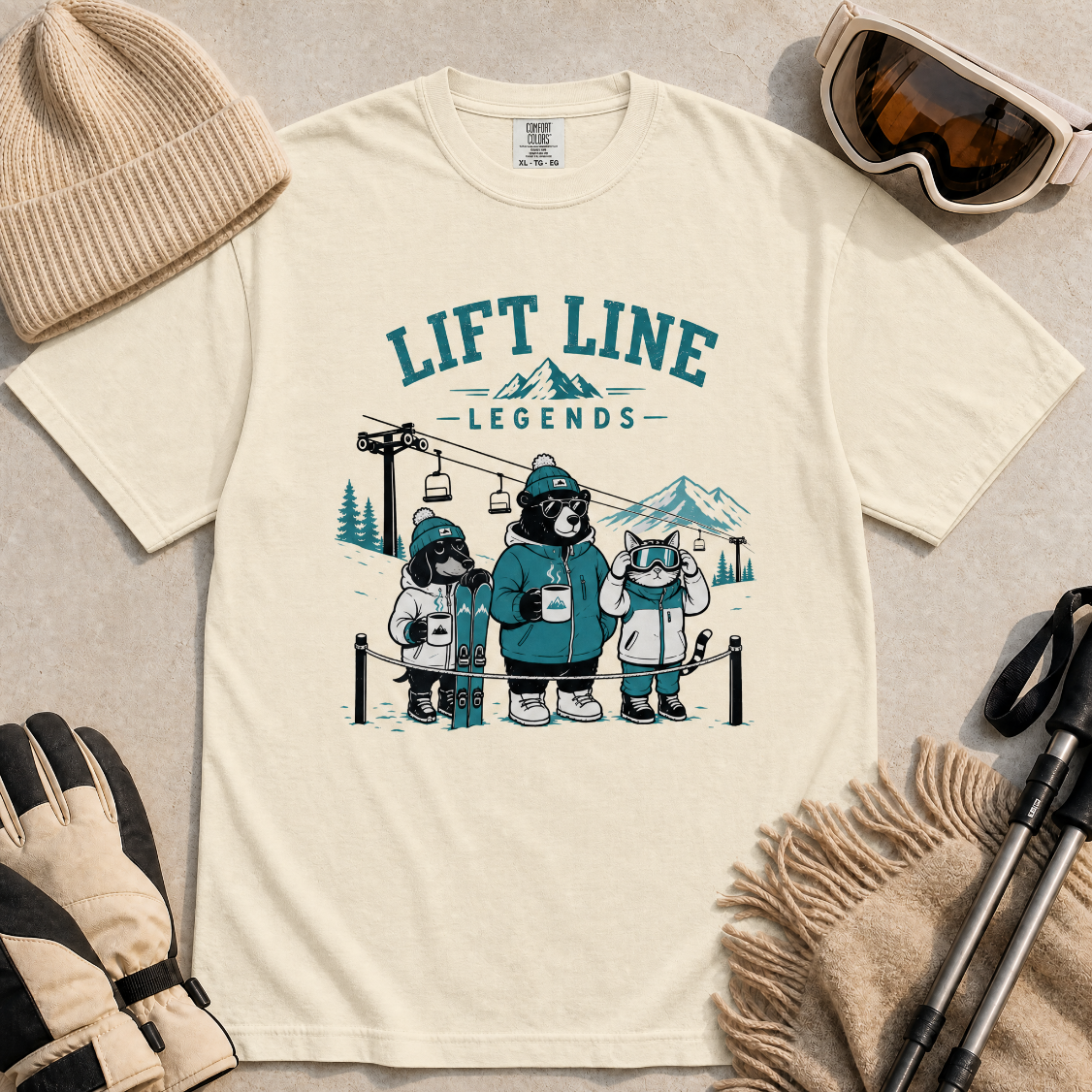 Ivory white t-shirt with 'Lift Line Legends' graphic design featuring a bear, cat, dog, and a ski lift.
