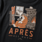 Black t-shirt with a graphic of a cat by a fireplace and skis, with 'Après All Day' text.