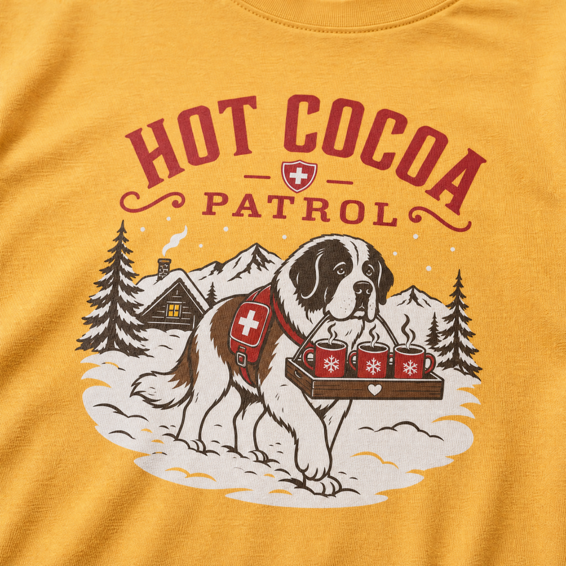 Mustard yellow t-shirt with a graphic of a dog and 'Hot Cocoa Patrol' text.