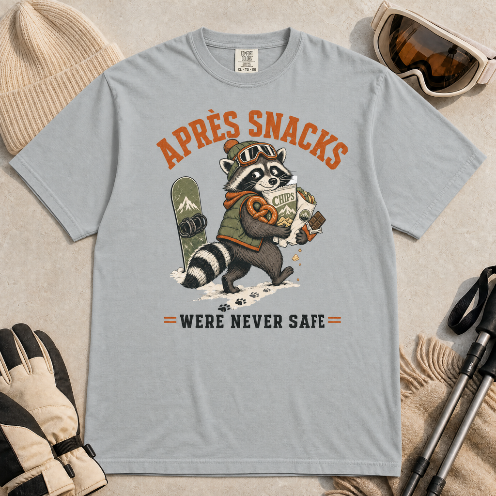 Granite gray t-shirt with a raccoon stealing snacks graphic and "Après Snacks Were Never Safe" text.