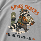 Granite gray t-shirt with a raccoon stealing snacks graphic and "Après Snacks Were Never Safe" text.