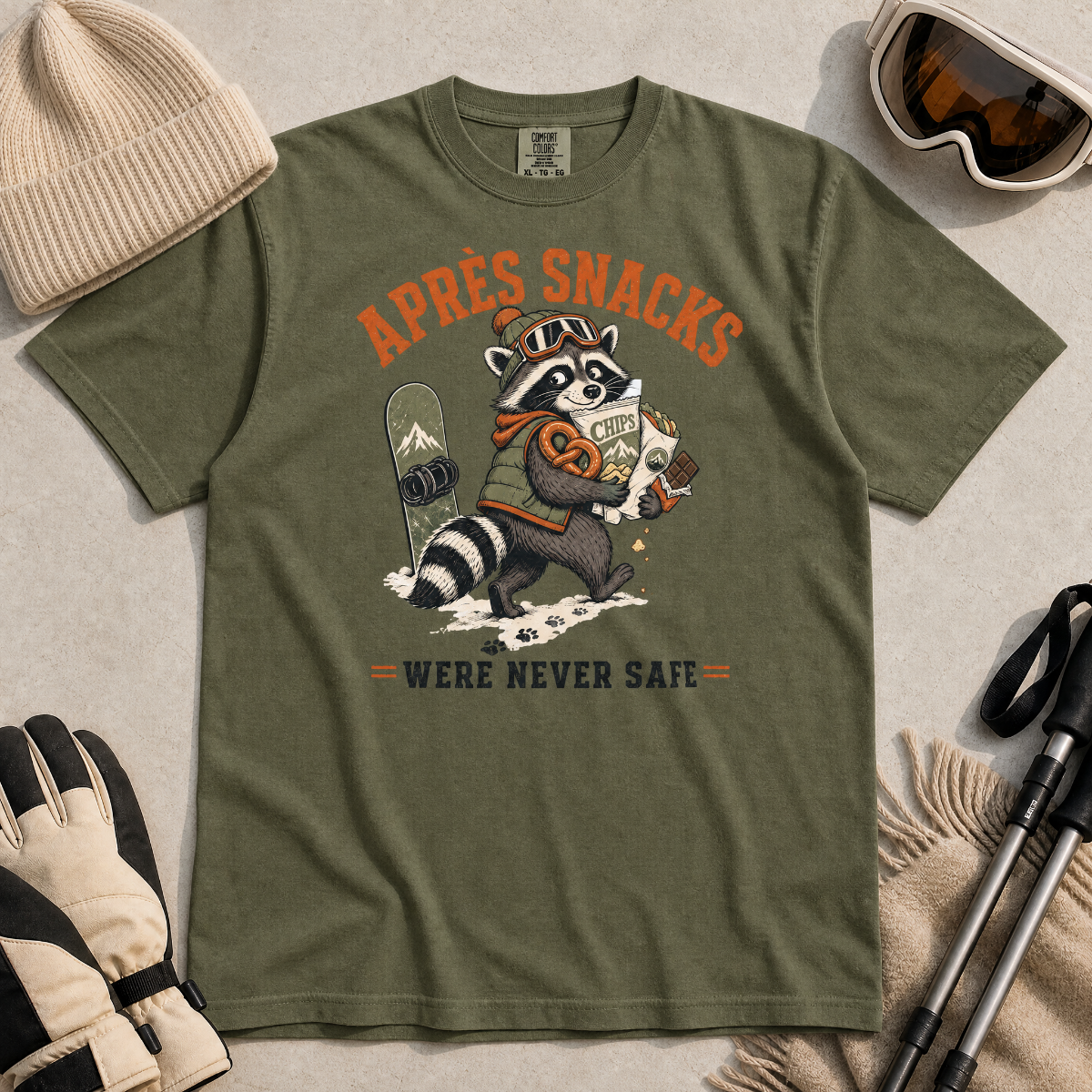 Hemp green t-shirt with a raccoon stealing snacks graphic and "Après Snacks Were Never Safe" text.