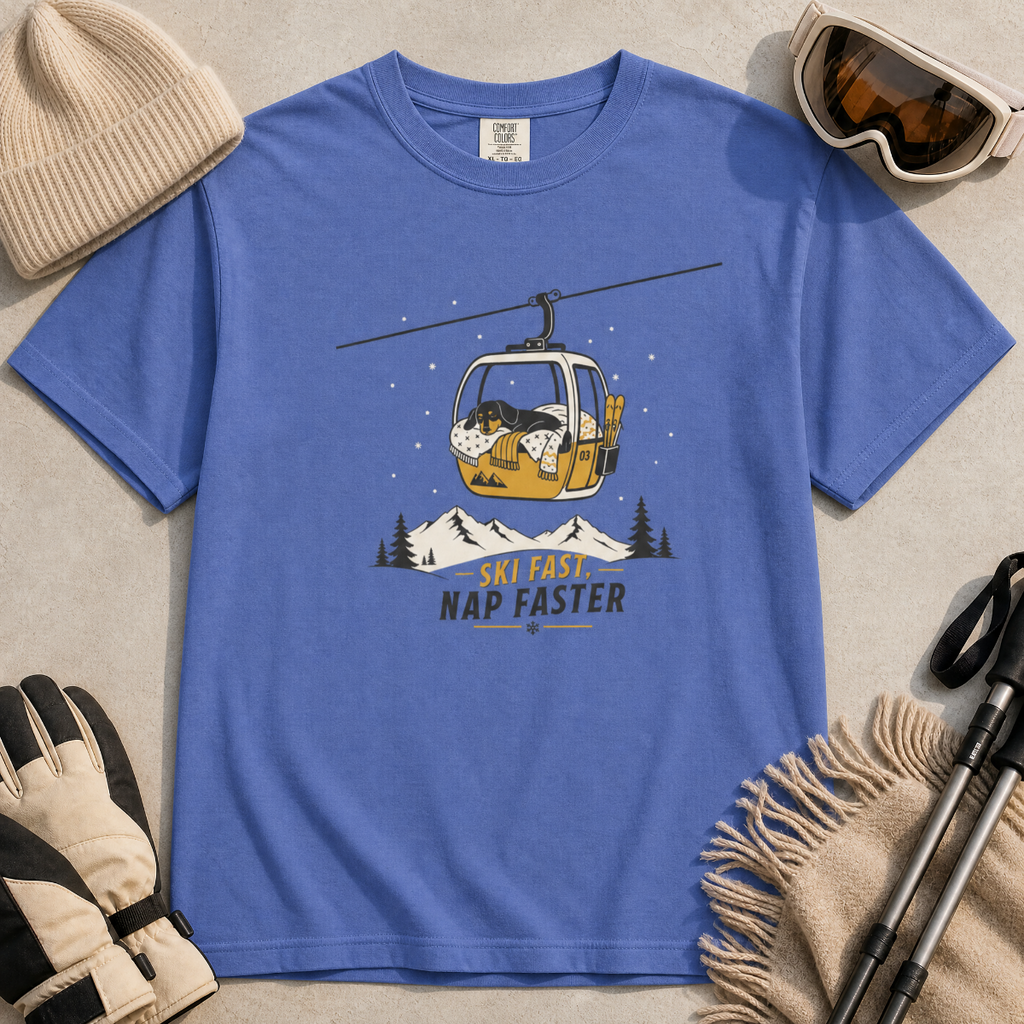 Mystic blue t-shirt with a graphic of a dog in a gondola lift and text 'Ski Fast Nap Faster'.