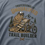 Blue jean colored t-shirt with a beaver graphic and text 'Professionally Unqualified Trail Builder'