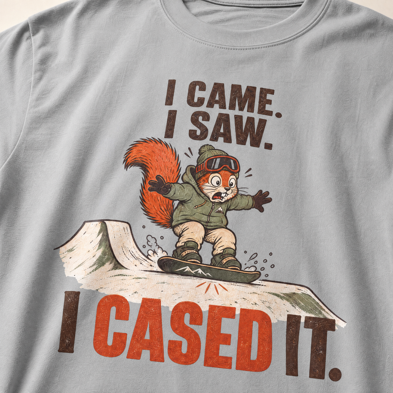 Granite gray t-shirt with a graphic of a squirrel on skis and text 'I CAME. I SAW. I CASED IT.'