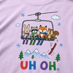 Close-up of an orchid t-shirt with a childlike crayon-style ski design showing four animals on a chairlift, a loose red ski falling below, and colorful “UH OH.” text.