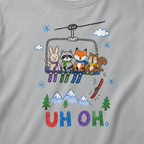 Close-up of a granite gray t-shirt with a childlike crayon-style ski design showing four animals on a chairlift, a loose red ski falling below, and colorful “UH OH.” text.