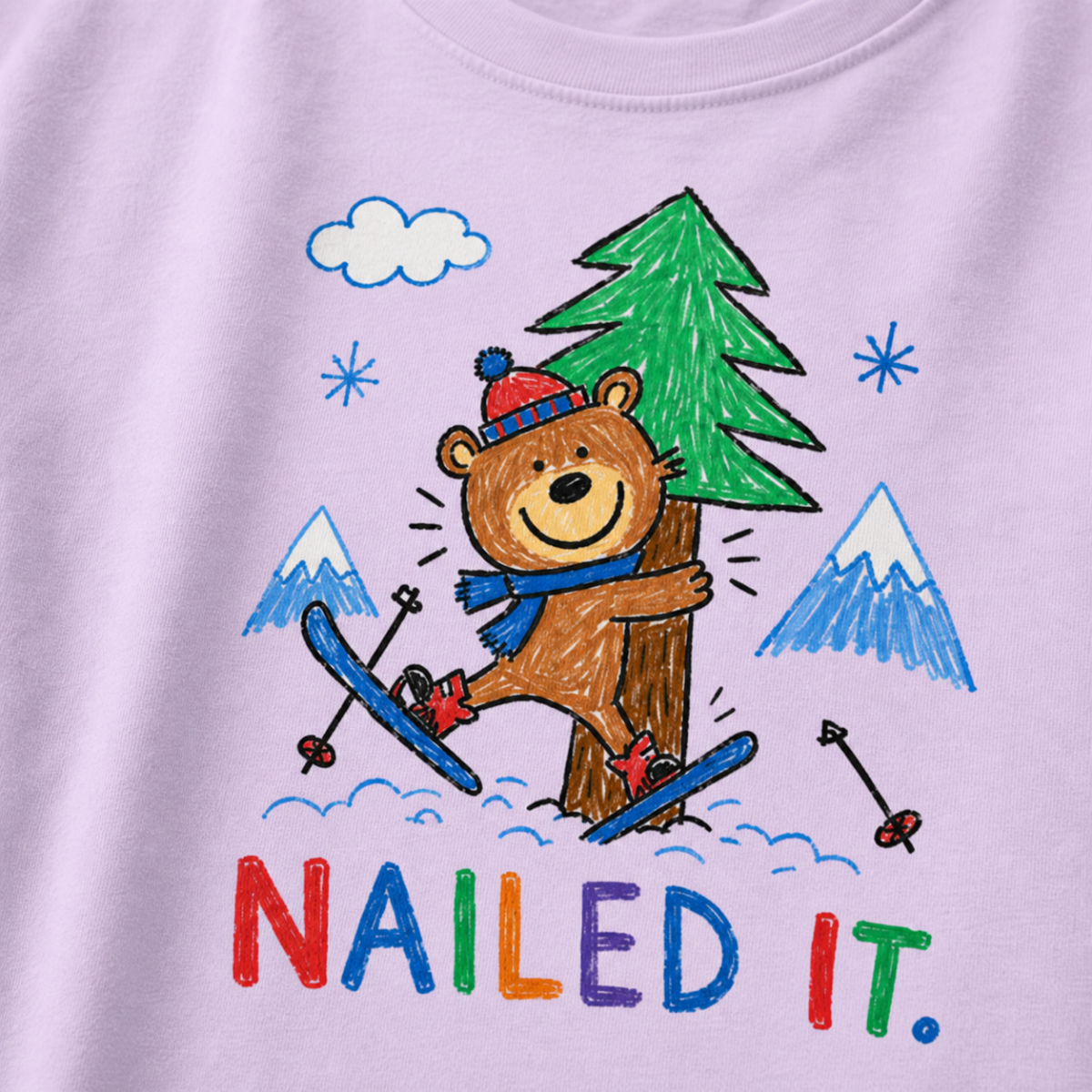 Close-up of an orchid t-shirt with a childlike crayon-style ski design showing a smiling bear hugging a tree, with colorful “Nailed It.” text.