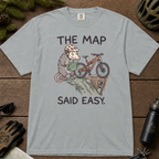 Flat lay of a granite gray t-shirt with a humorous mountain biking design showing a nervous opossum, an orange bike, and a dangerously steep trail.