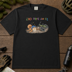 Flat lay of a black t-shirt featuring a humorous squirrel mountain bike crash design with an upside-down “Is My Bike OK?” message.