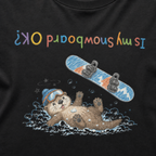 Close-up of a black t-shirt showing a crashed otter in ski goggles with a snowboard flying overhead and colourful upside-down “Is My Snowboard OK?” text.