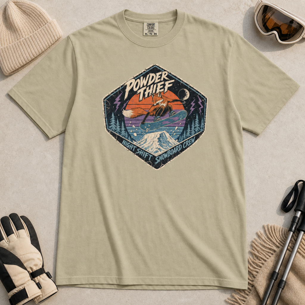 Khaki t-shirt featuring a distressed retro fox snowboarder jumping over a snowy mountain beneath “Powder Thief” lettering.
