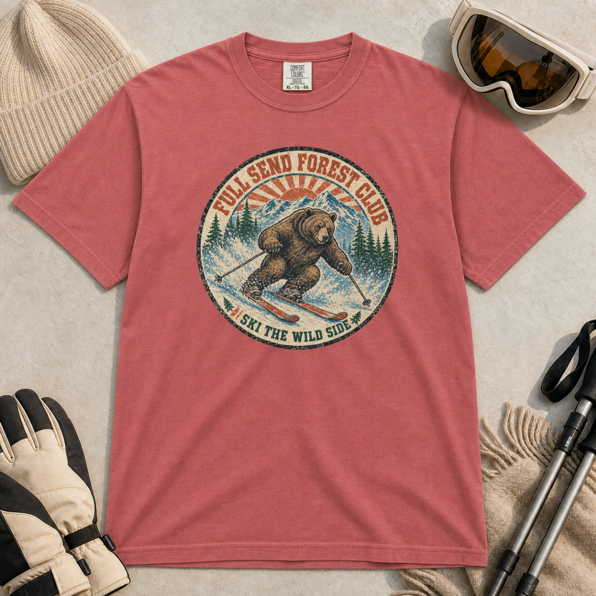 Crimson red t-shirt featuring a vintage ski bear carving through powder beneath “Full Send Forest Club” and “Ski the Wild Side” text.