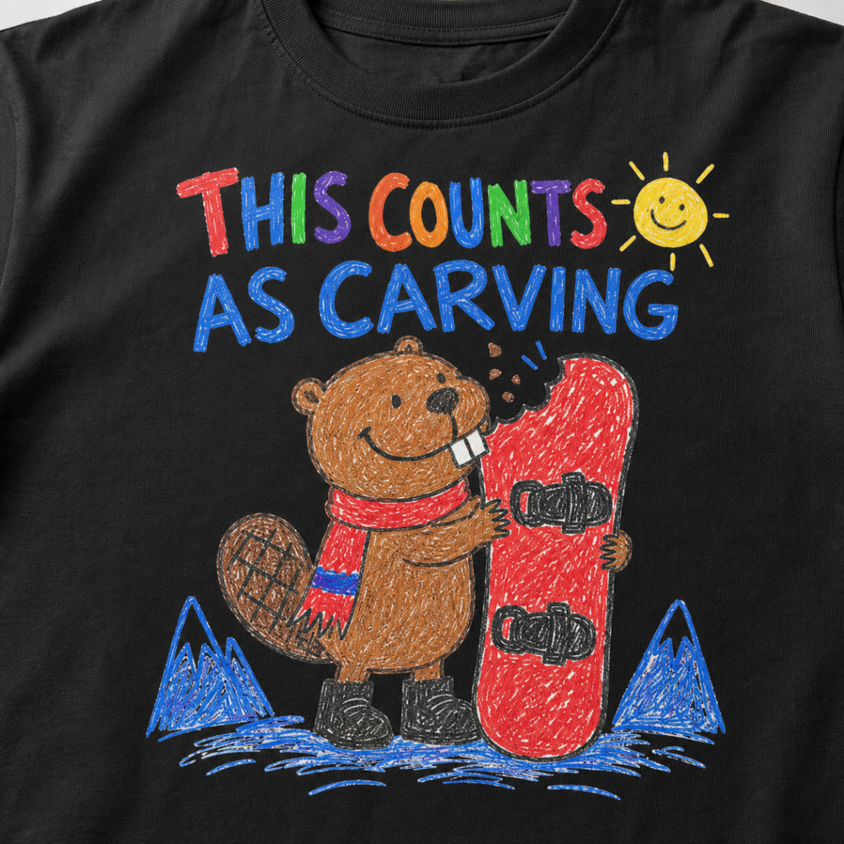 Close-up of a black t-shirt featuring a childlike crayon-style beaver biting a red snowboard, with colourful “This Counts as Carving” text.