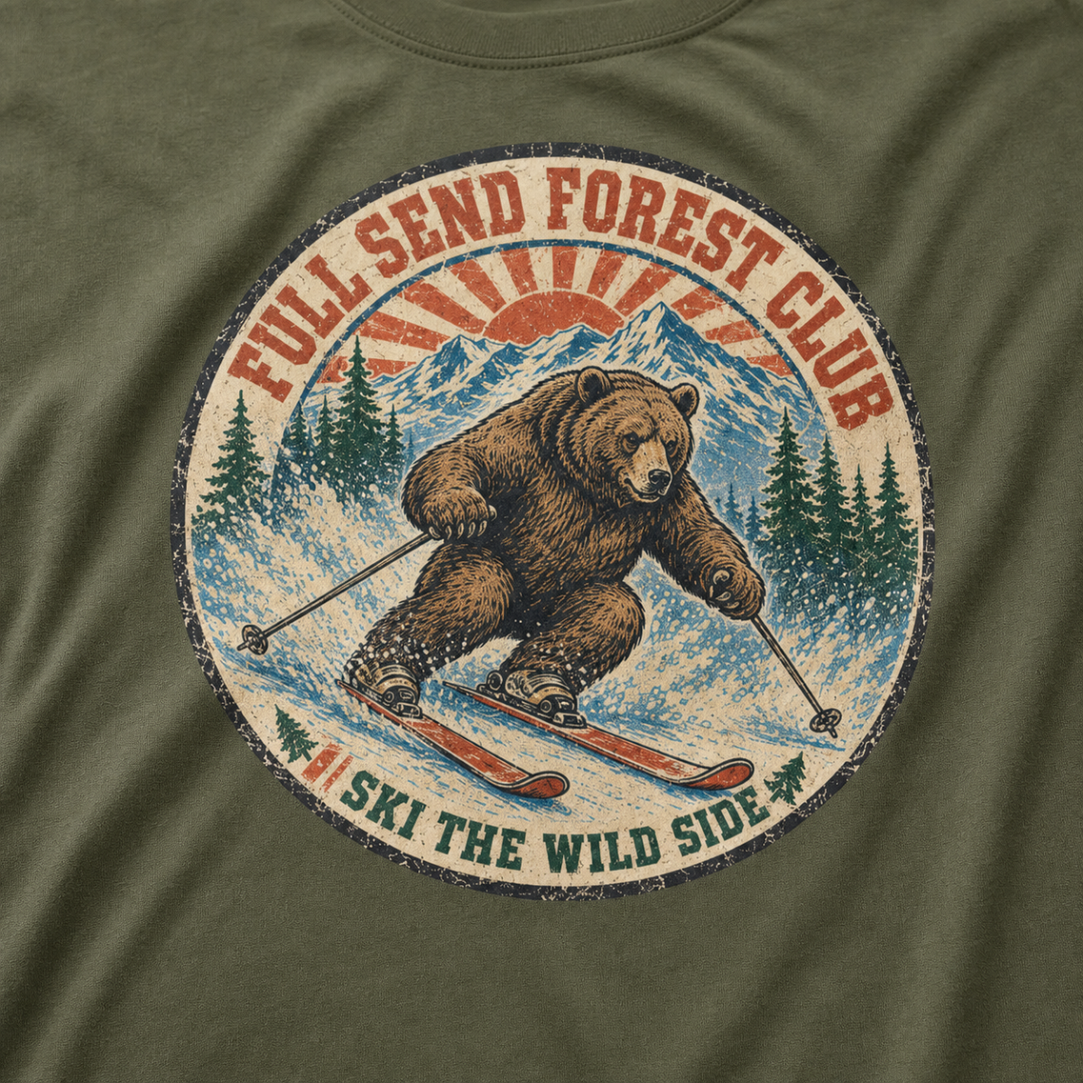 Close-up of a distressed vintage-style bear skiing through snowy mountains with “Full Send Forest Club” and “Ski the Wild Side” lettering.