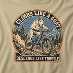 Close-up of a distressed mountain biking design featuring a goat descending a rocky trail with alpine peaks and “Climbs Like a Goat, Descends Like Trouble” lettering.