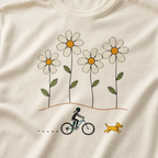 Close-up of a female mountain biker riding beside a yellow dog beneath four large hand-drawn daisies.