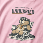 Close-up of a beaver relaxing in a folding chair with a mug, ski goggles and necktie beneath “Professionally Unhurried” text.