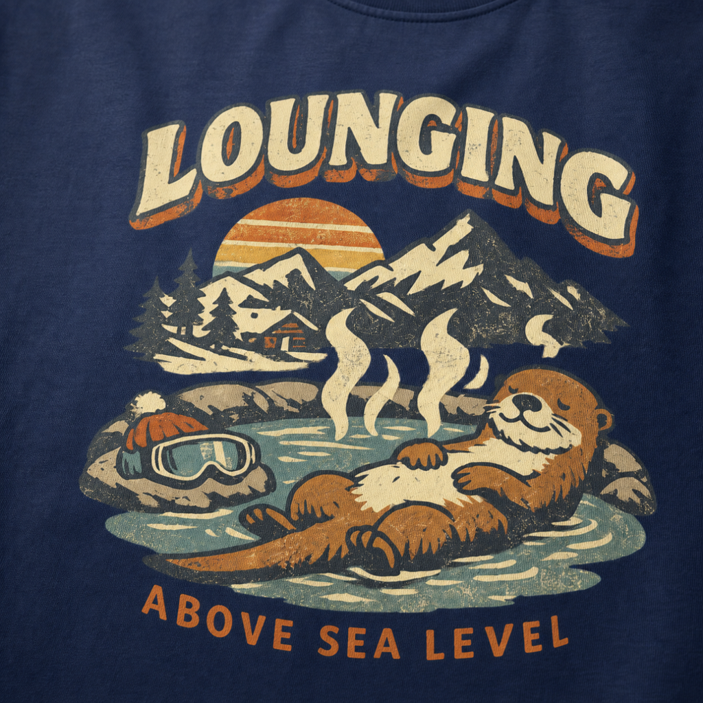 Close-up of a vintage otter hot spring design with snowy mountains, a sunset and the words “Lounging Above Sea Level.”