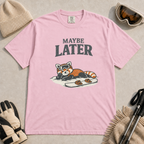 Blossom pink t-shirt featuring a relaxed red panda in ski goggles lying beside a snowboard beneath the words “Maybe Later.”