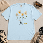 Chambray blue t-shirt featuring a small female mountain biker and yellow dog beneath four oversized daisies.